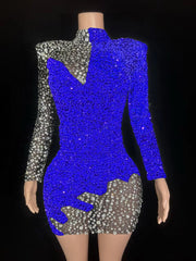 Mannequin wearing a blue and silver sequin dress on a black background